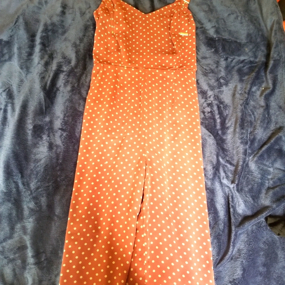 Terracotta polka dot jump suit.